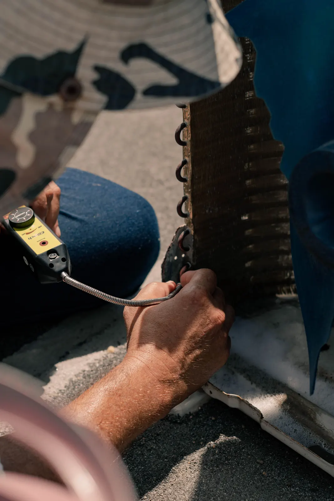 Technician repairing an air conditioner