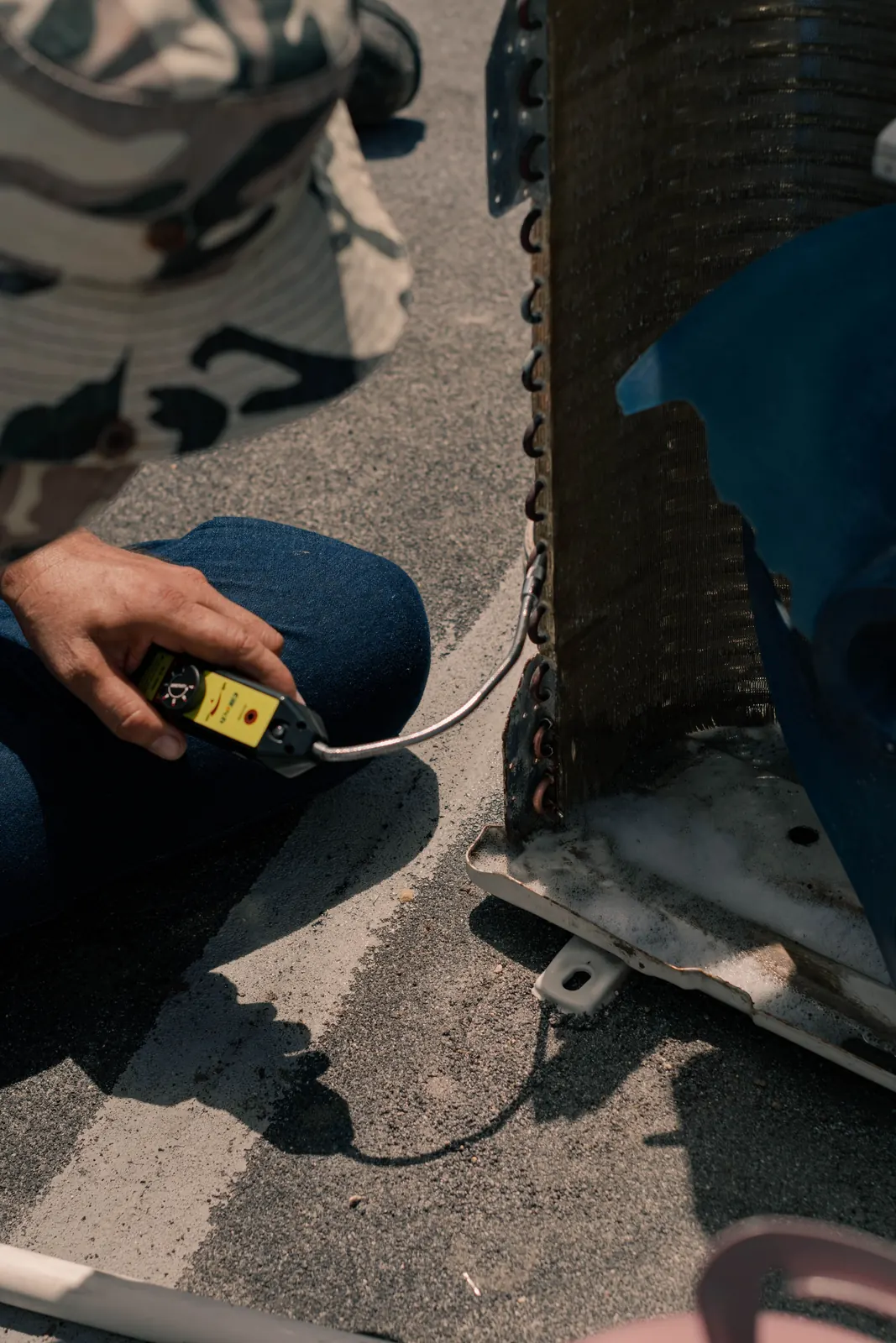 Technician repairing AC electrical wiring